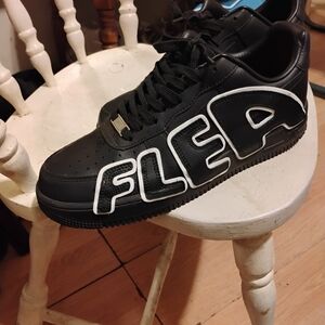 Nike Black Sneakers with Bold White Lettering